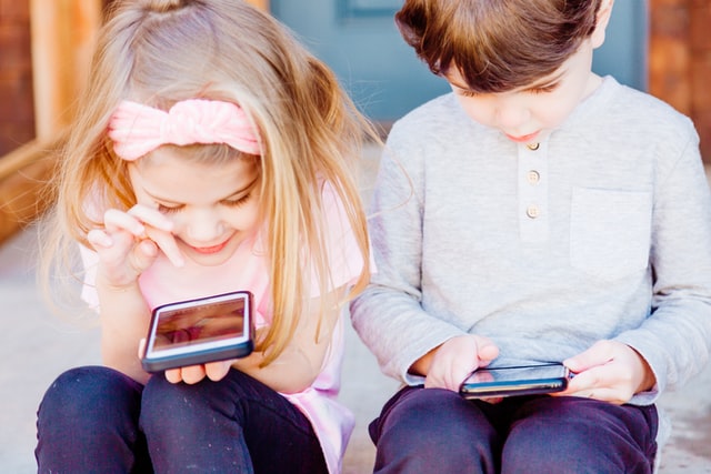 girl and boy on phones