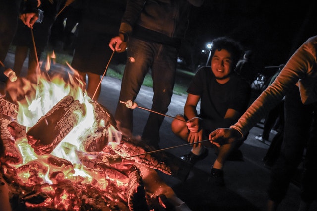 family at camp fire