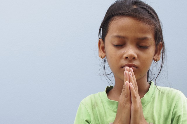 girl praying white background