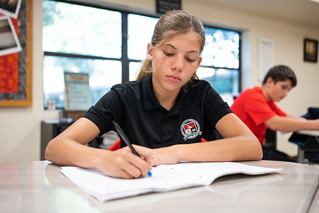 girl in class doing classwork